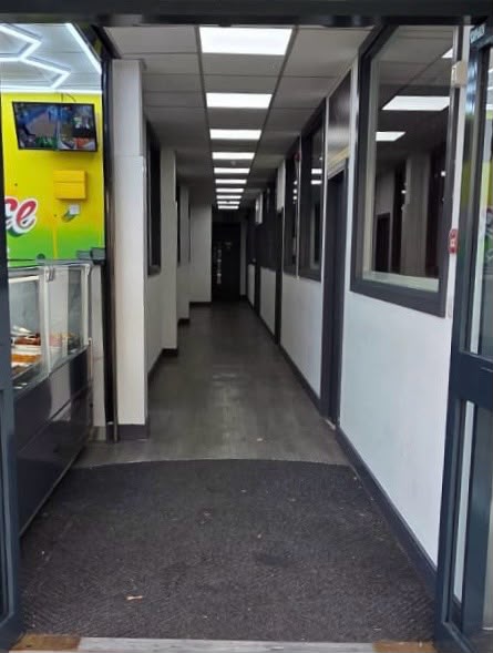 The internal aisle running between the units
